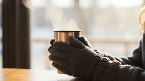 warmth in a cup: a cozy moment with a steaming mug, perfect for embracing the comforts of the season and enjoying a peaceful moment of reflection