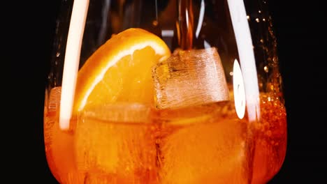 refreshing aperol spritz with ice and orange slice