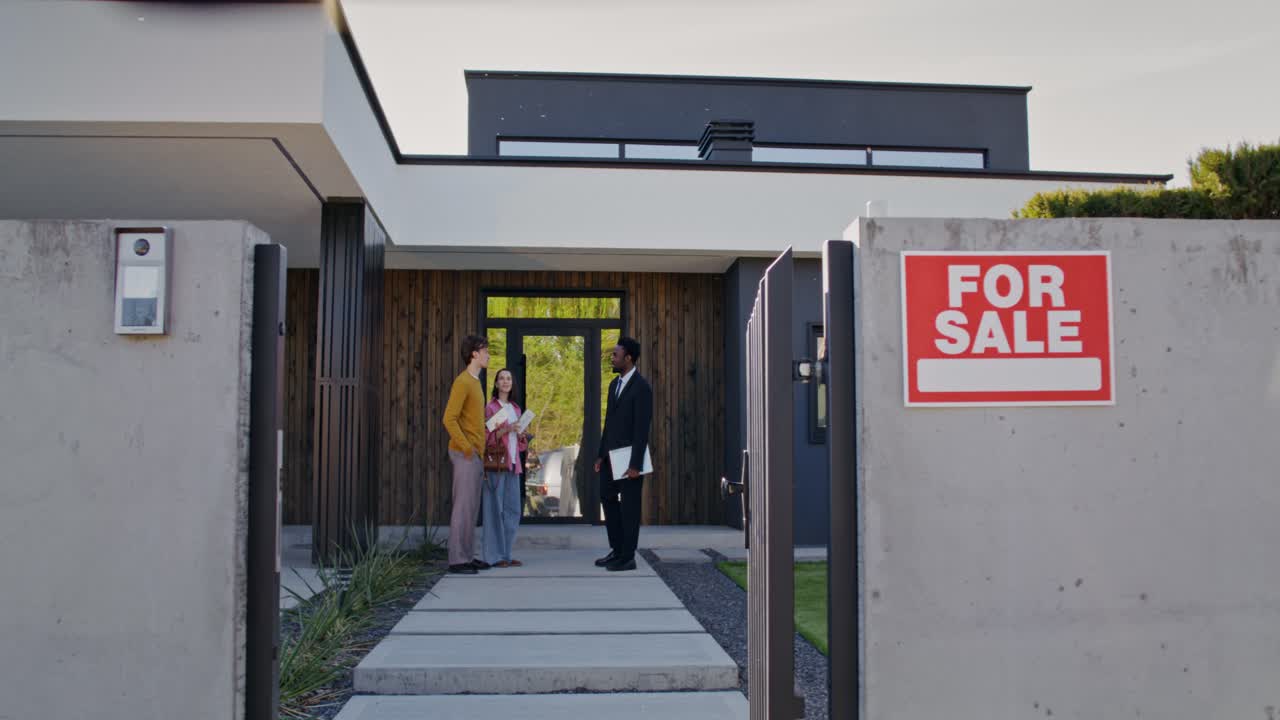 Potential Buyers Viewing a Modern House for Sale
