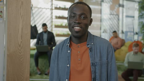 smiling man in a modern office