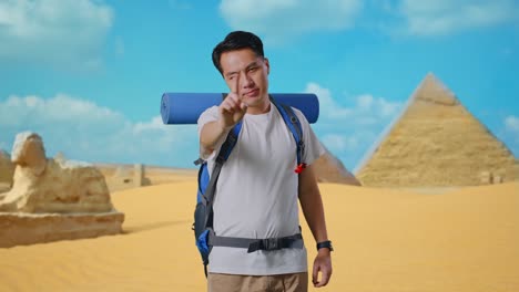 tourist pointing at pyramid in egypt
