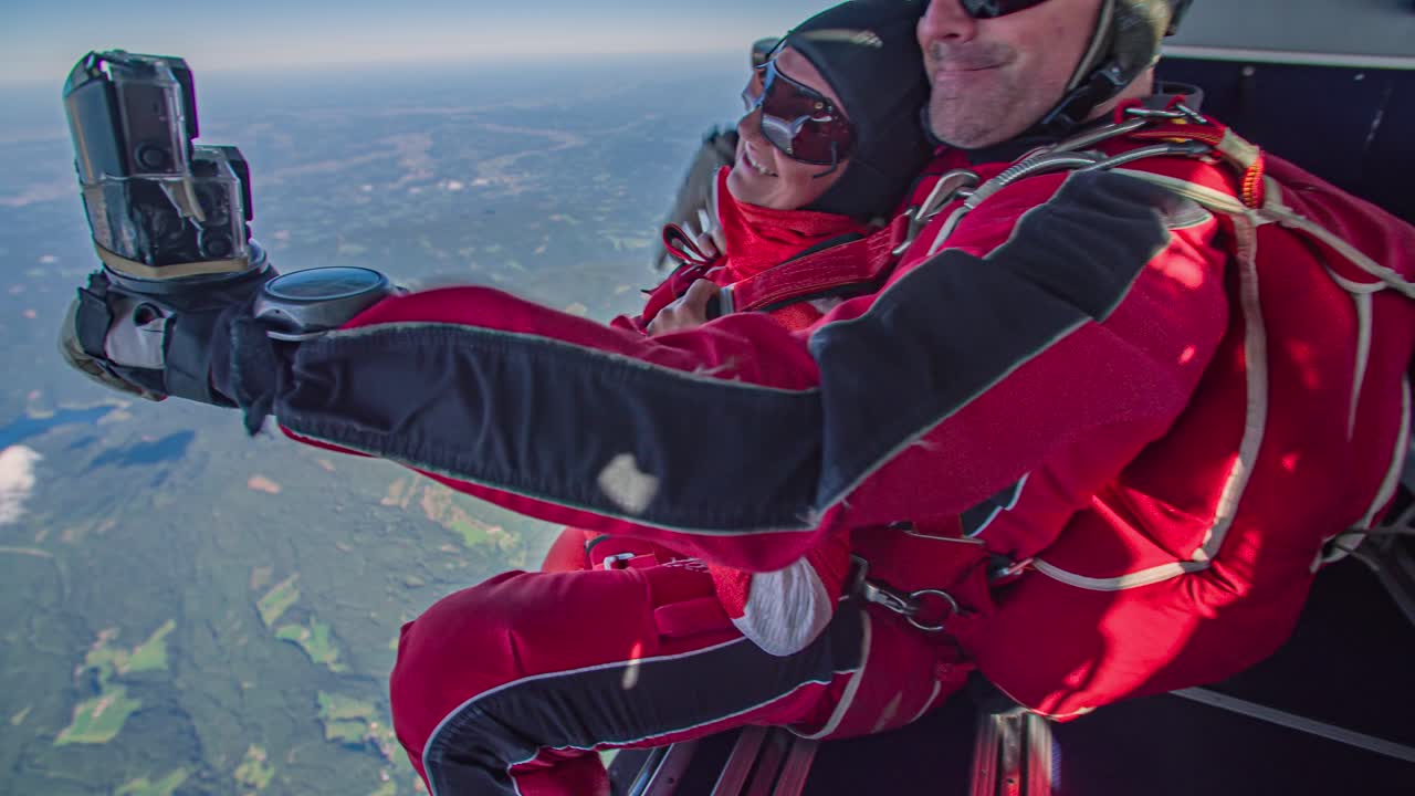 Instructor and student skydivers jump out airplane. Tandem jump, adrenalin rush