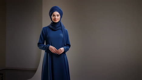 woman in blue hijab and dress