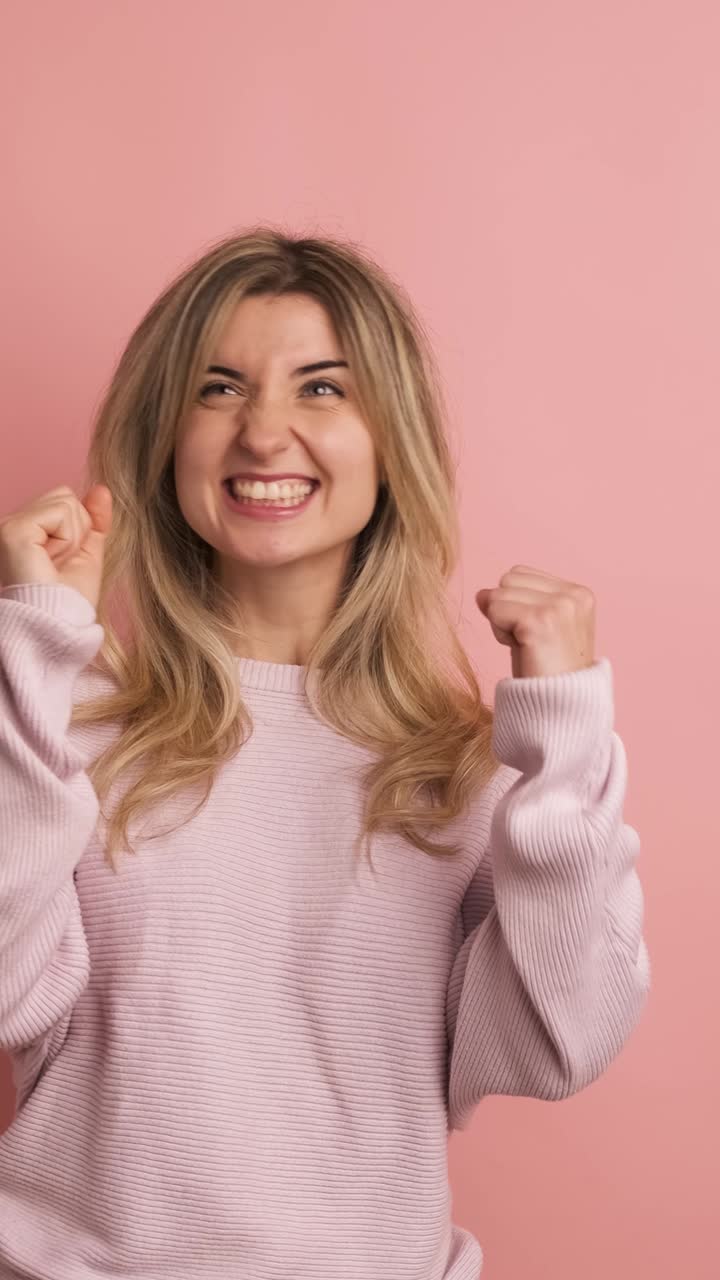 Pensive woman with hand on chin looking up distracted