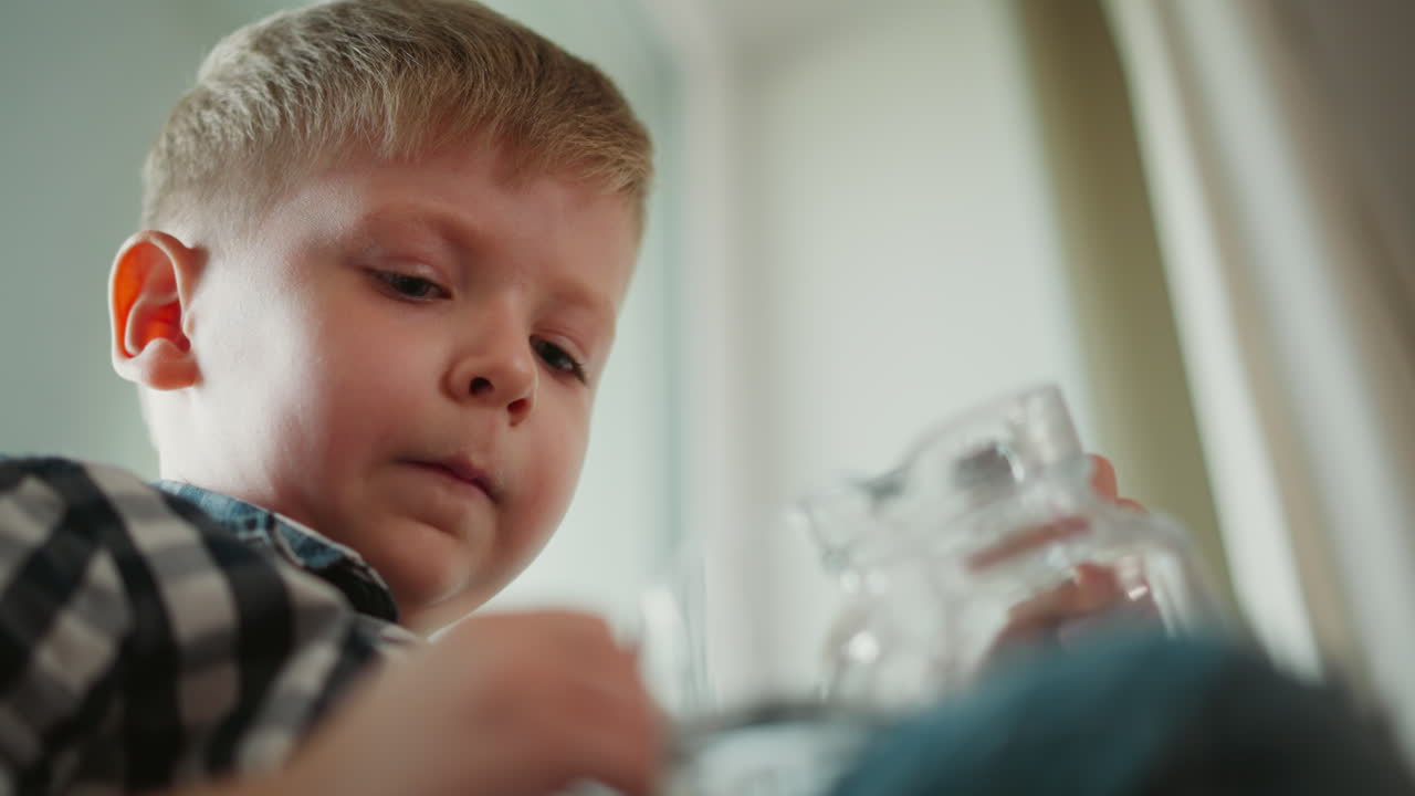 Young boy drinking water