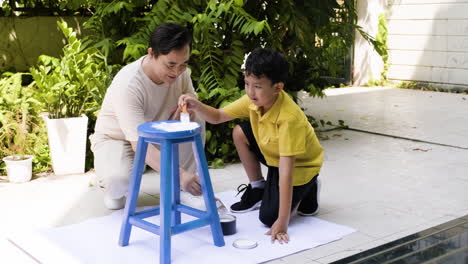 asian man and boy in the backyard