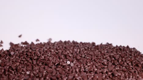 chocolate chips cascading onto a pile