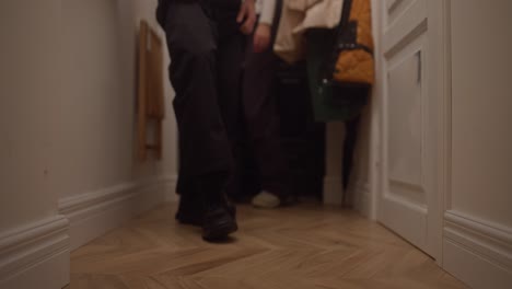 people walking through a hallway