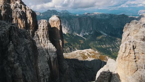 extremely steep mountain walls and peaks in the high mountains of the dolomites in italy with even more mountains in the background