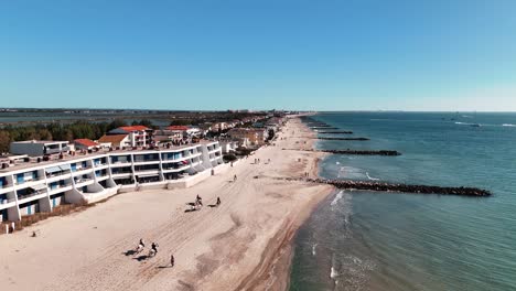 aerial fly-over: feria horses galloping on palavas shoreline, france