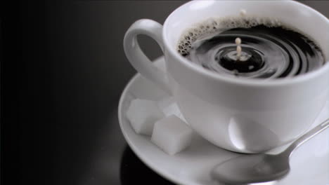 drop of milk falling in super slow motion in coffee