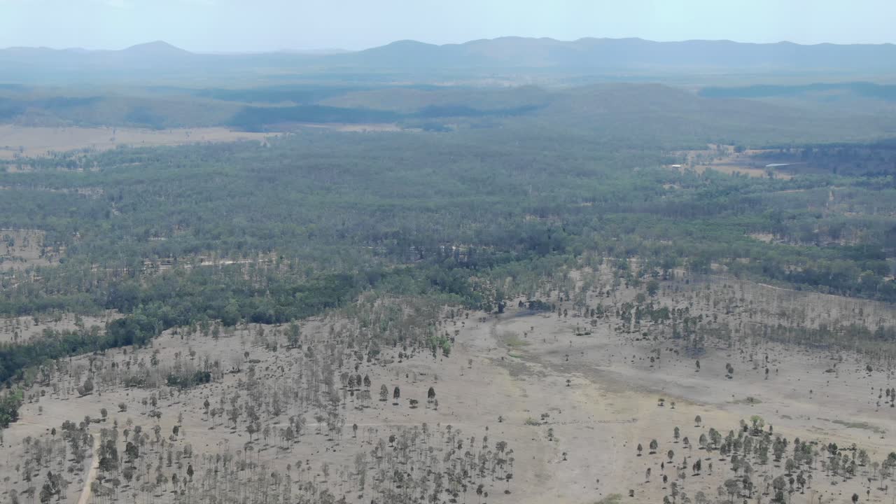Deforestation in outback of Queensland in Australia. Aerial raising backward pov