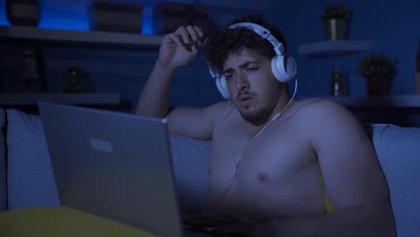 young man watching horror and thriller movies, documentaries.
