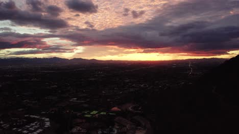 tilting down shot from pink arizona skies to reveal sprawling neighborhoods