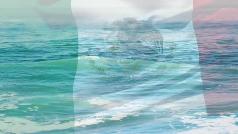 composición digital de ondear la bandera de méxico contra las olas en el mar