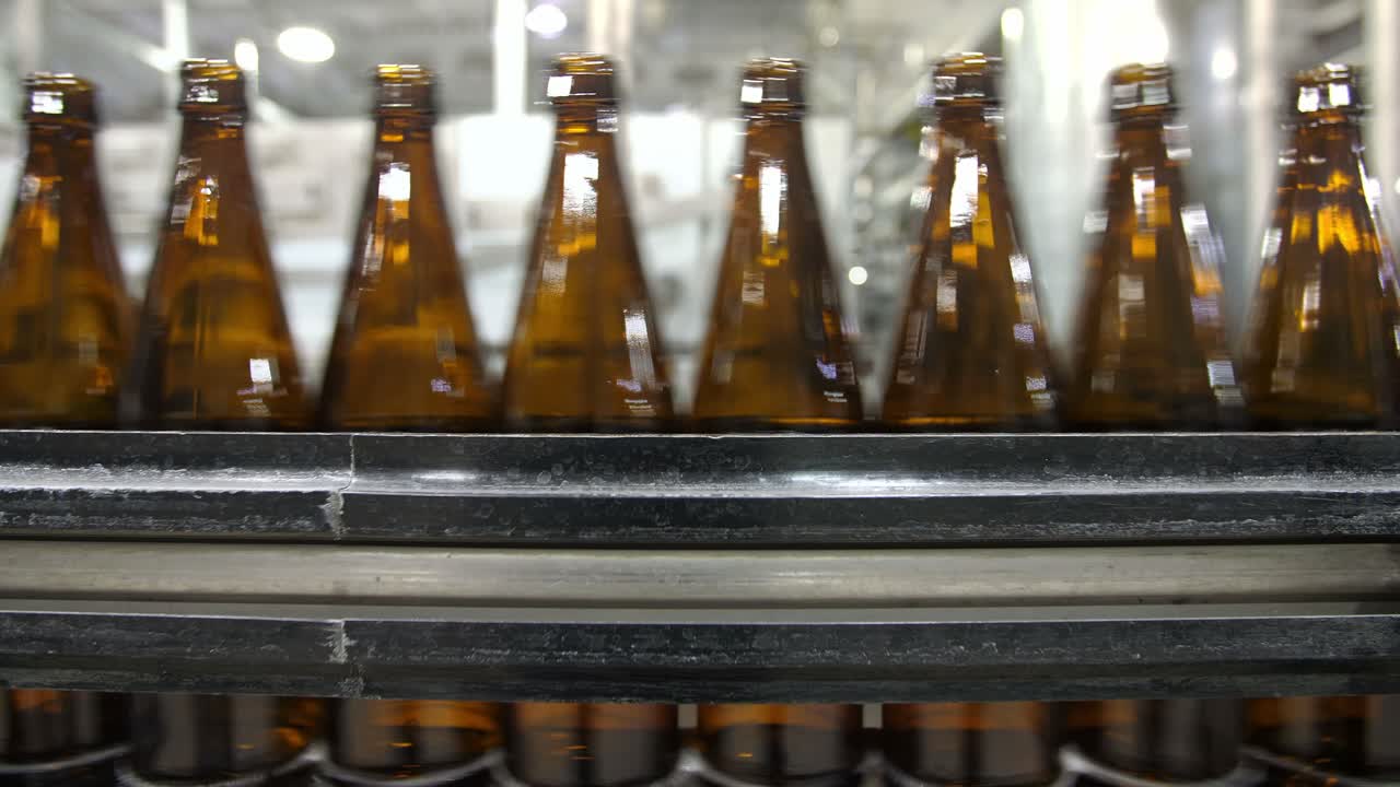 Bottles on a Conveyor Belt in a Brewery