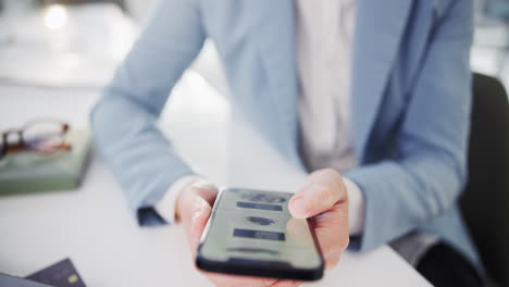 businesswoman holding mobile phone
