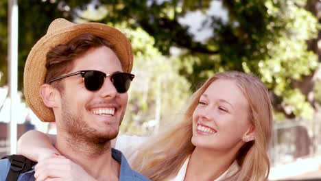 Smiling-hipster-couple-looking-at-camera-