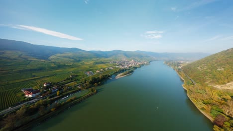 slow aerial shot of the river danube, market town spitz, and the surrounding nature