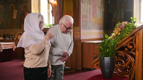 old man and woman in church