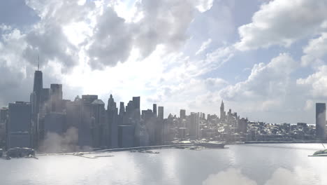 panoramic city skyline by water under cloudy sky
