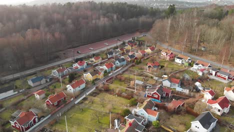 aerial footage of some beautiful picturesque cottages in delsjon, gothenburg, sweden