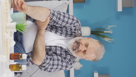 Vertical-video-of-Old-man-with-elbow-pain.