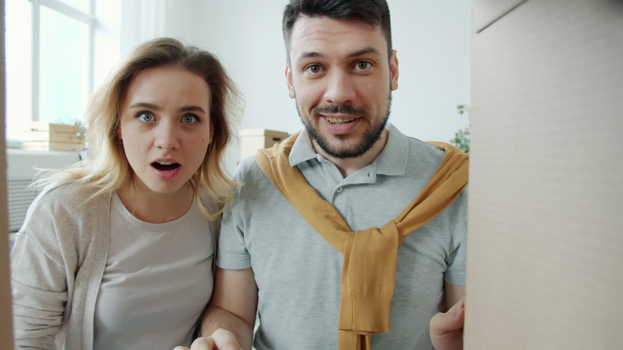 Excited Couple Moving Into Their New Home