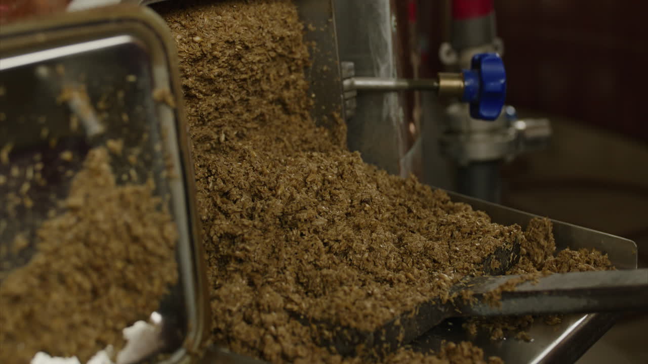 Beer brewery malt from tank slowmotion