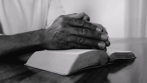 man praying with the bible on white background stock footage