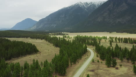 country fields and road at the foot of the mountainside