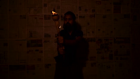 indian monk with mashal(fire stick torch)