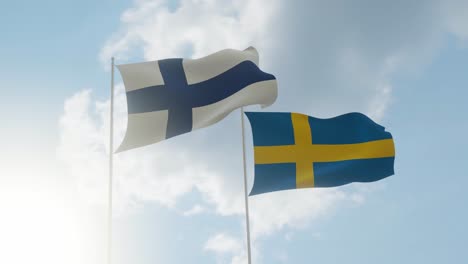 flags of finland and sweden with bright sunny sky and white clouds