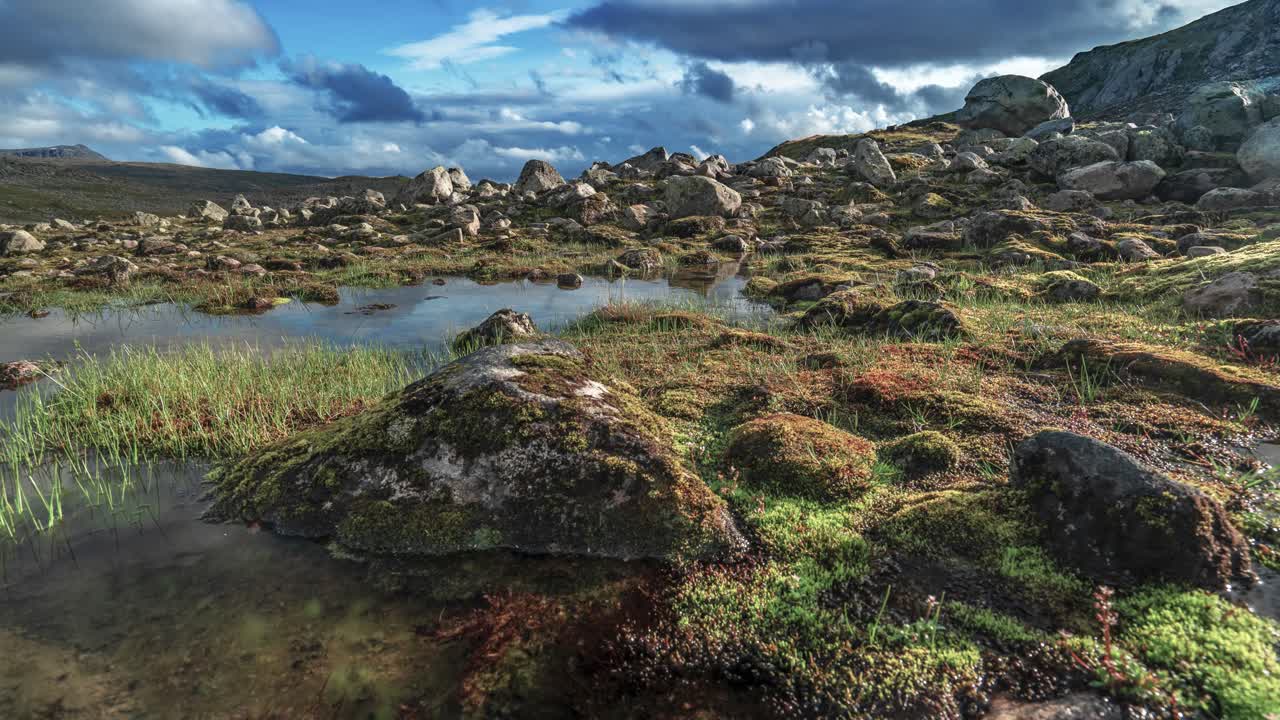 Dark clouds pass above the harsh Nordic landscape in a timelapse video