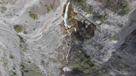 Aerial-flyover-birdseye-view-above-Bridal-Veil-Falls-in-American-Fork-Canyon,-Utah-during-spring