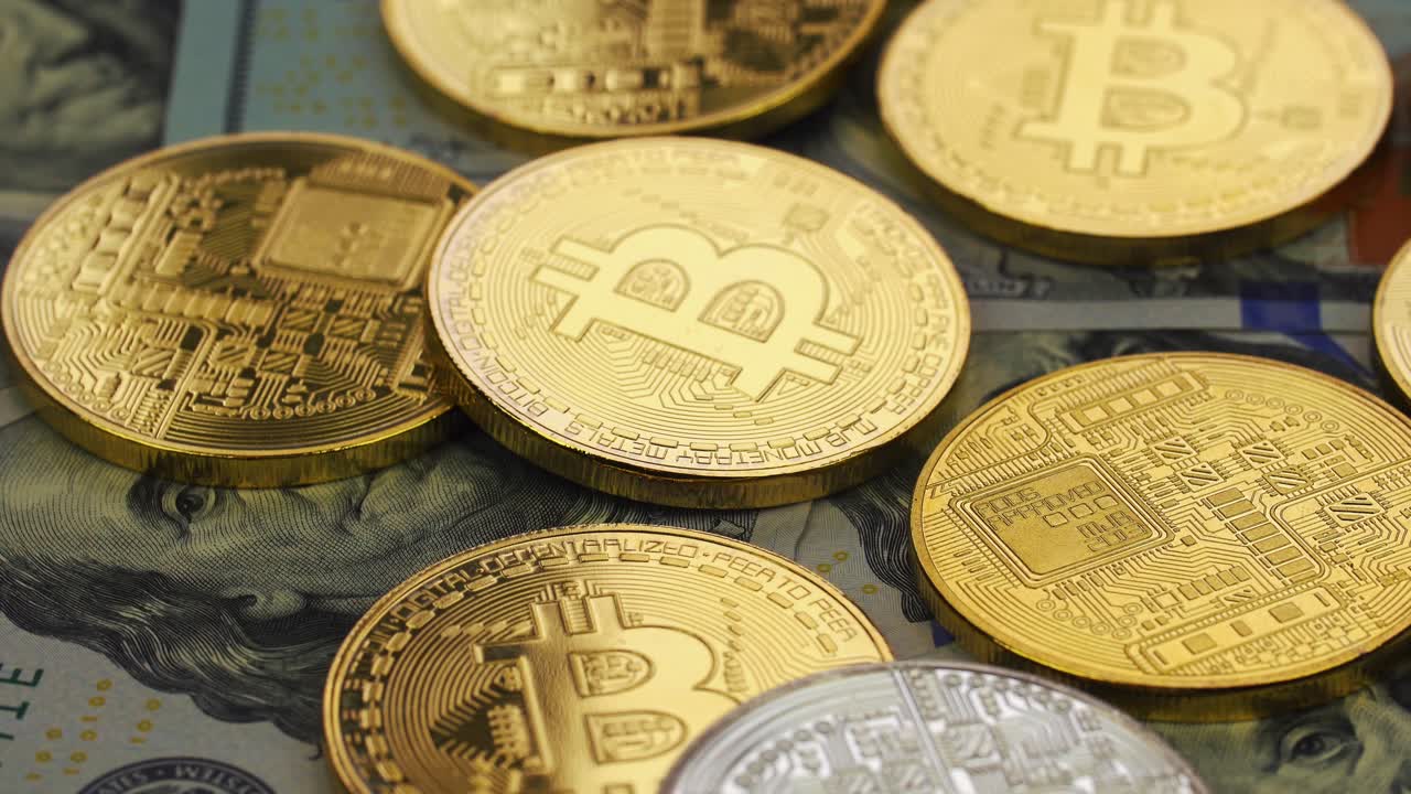 Bitcoin Cryptocurrency on US Dollar Bills