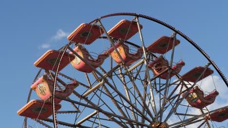 detail of the cabins of a rotating ferris wheel - slow motion