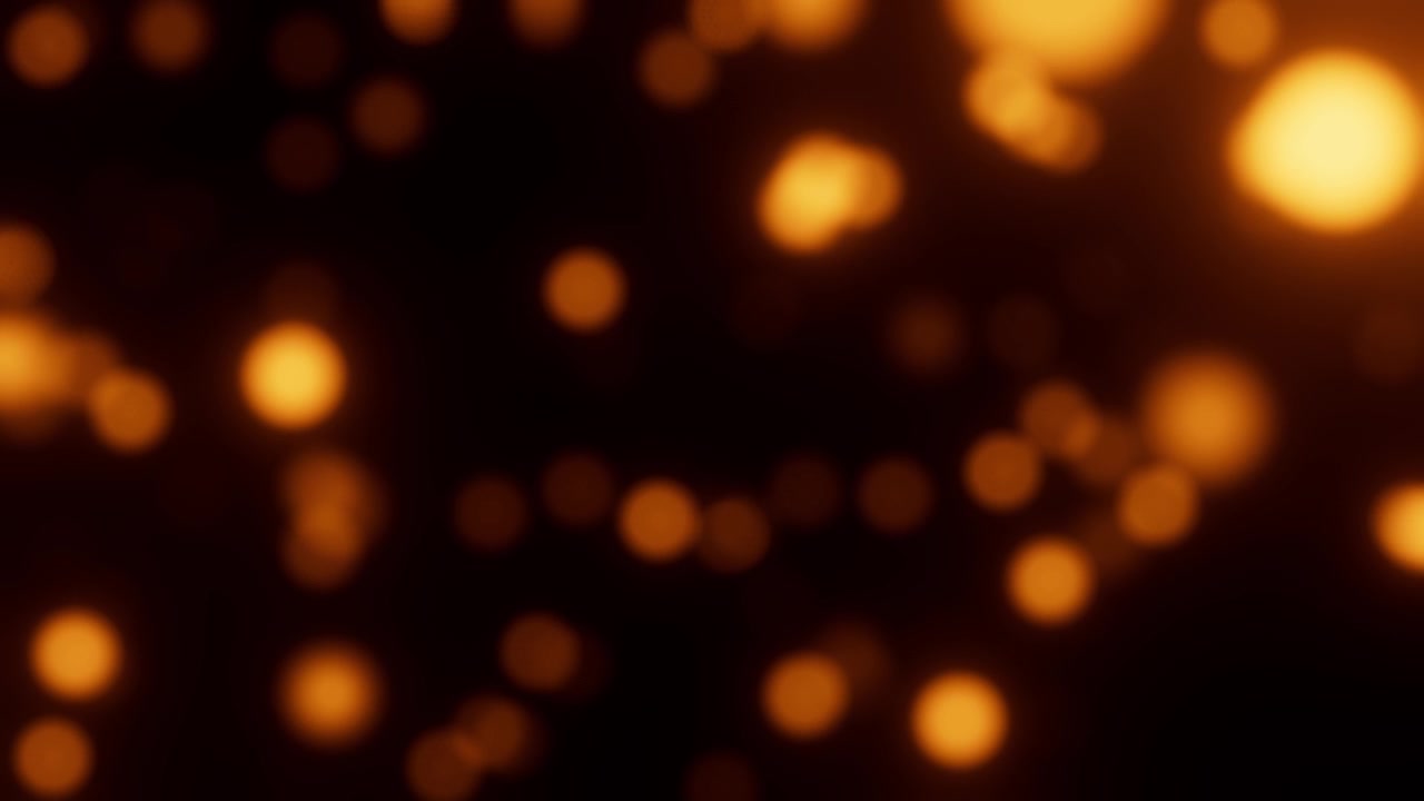 Luci bokeh dorate astratte che luccicano sullo sfondo scuro