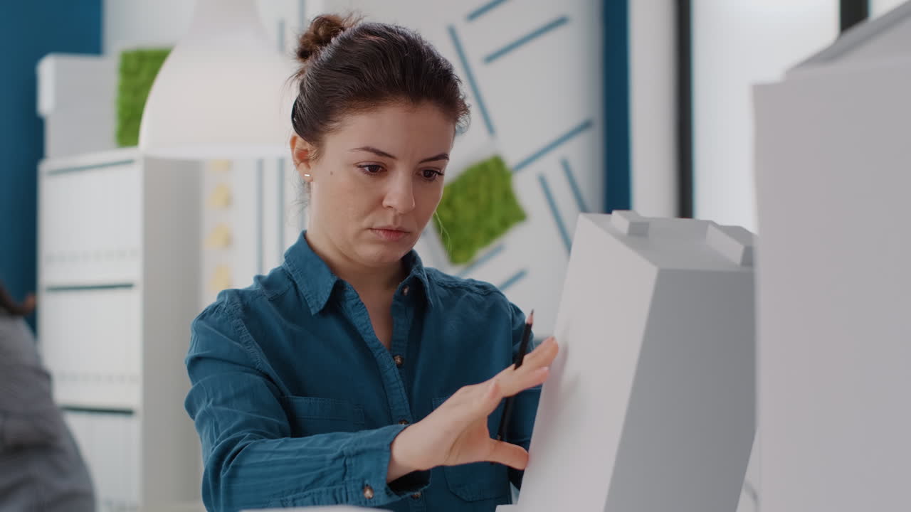 A woman working on a model