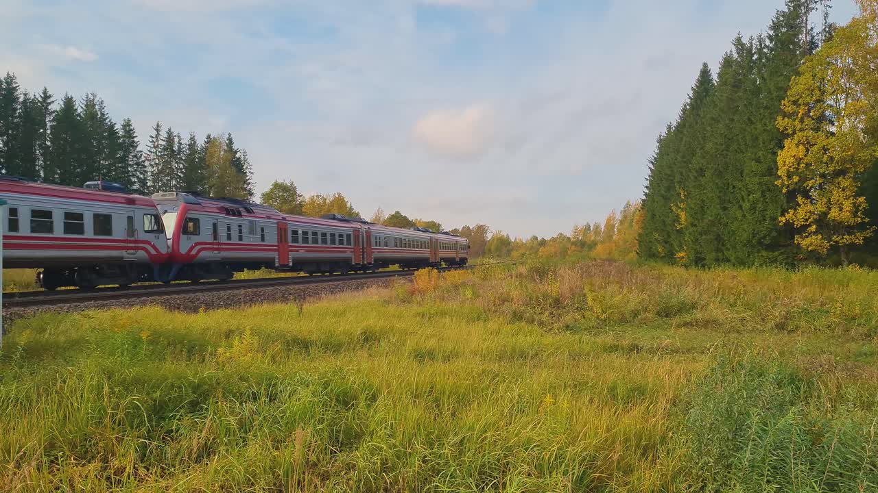 A passenger train runs along the railway