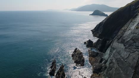 A-drone-shot-of-the-rugged-coastal-terrain-of-the-Dingle-Peninsula,-near-Dingle-Point,-in-Ireland