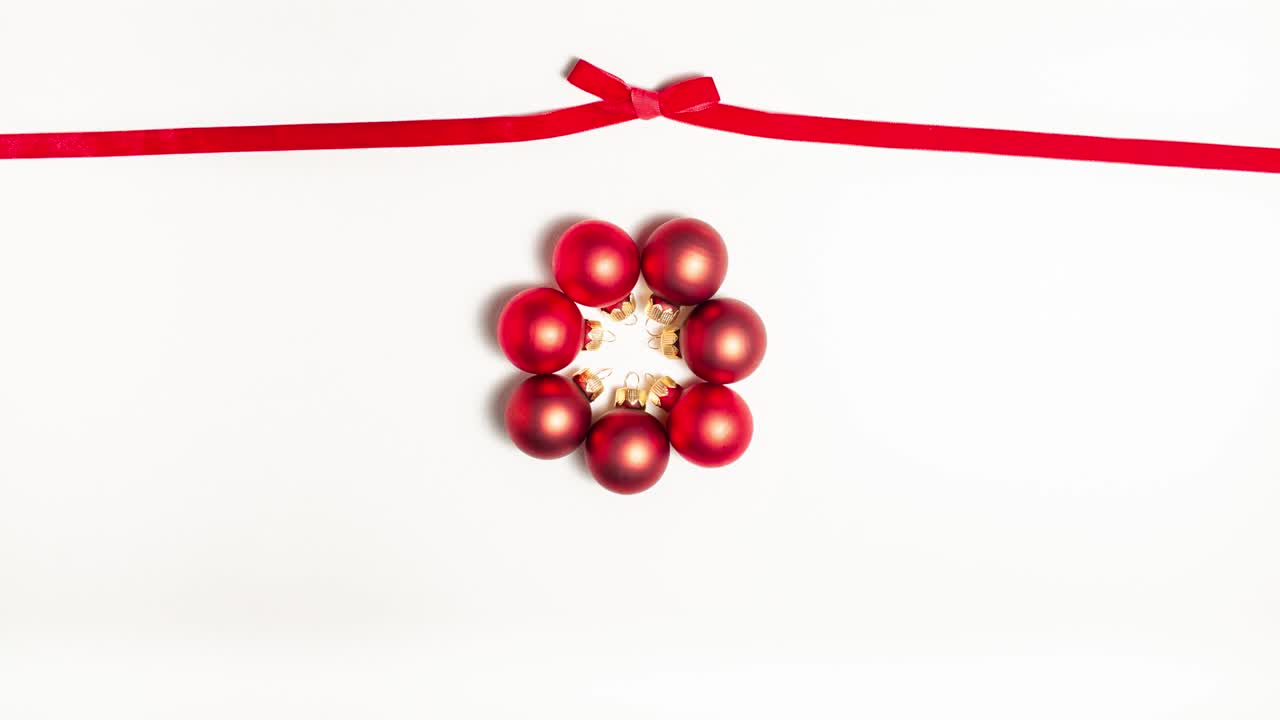 Red ribbon bow at the top and red evening balls. Christmas concept