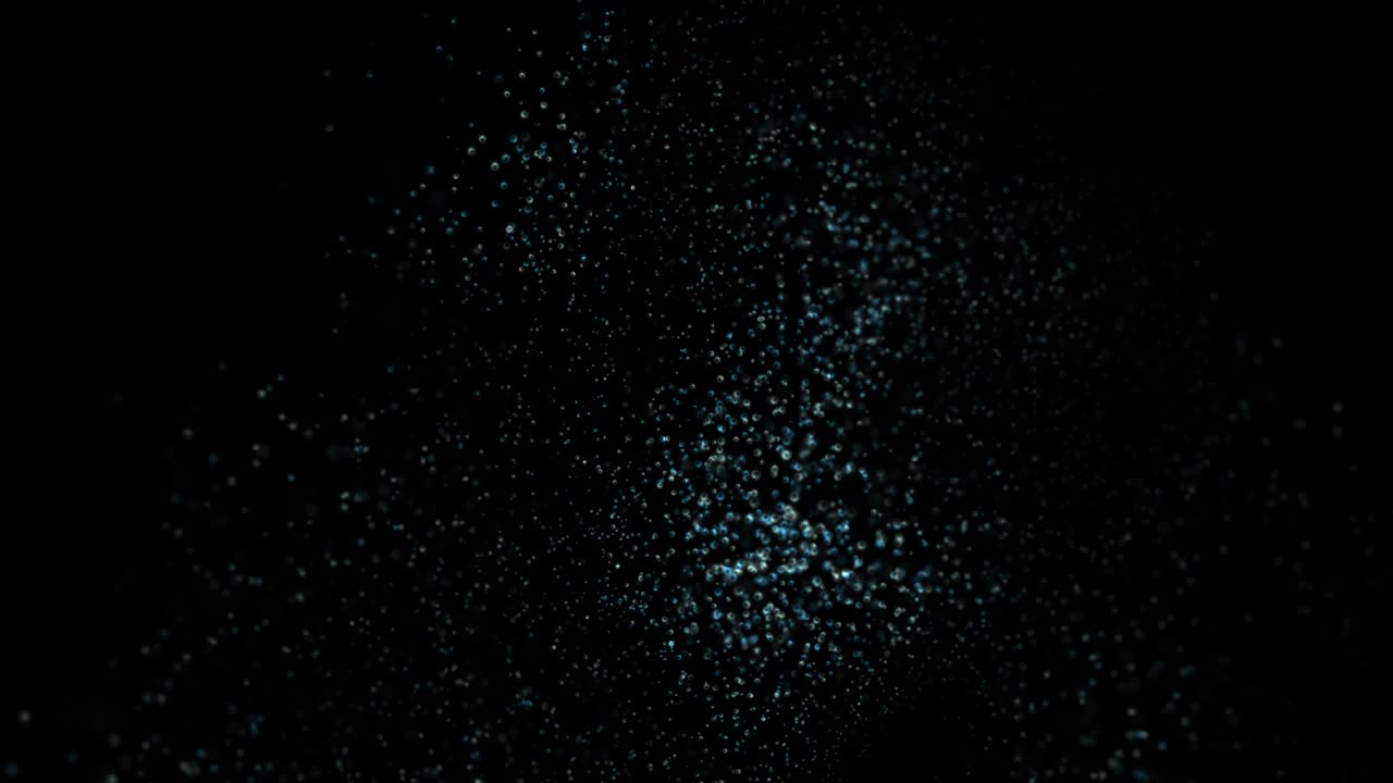 corriente de burbujas flotando turbulentemente en fondo negro con alfa