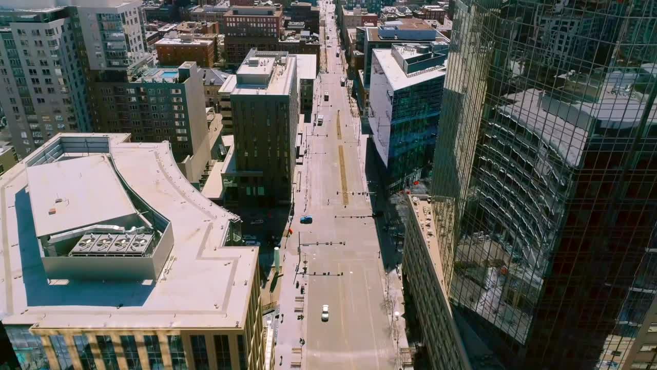 Downtown Denver aerial flyover of city and buildings.