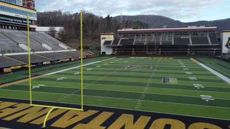 Appalachian-State-Football,-Kidd-Brewer-Stadium-Forward-Aerial-with-Goal-Post-in-shot,-Boone-North-Carolina