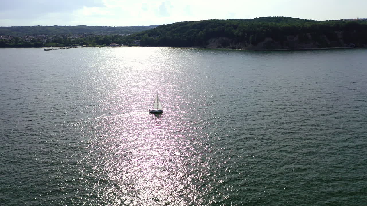 Aerial shot of drone flying above the ship sailing on the Baltic sea near Gdynia