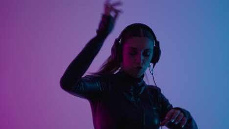 female dj mixing music in a studio