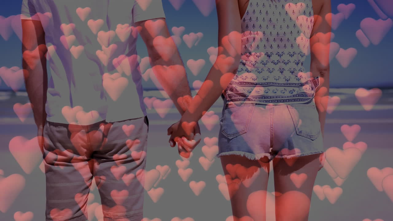 ⁇ 런타인 데이를 위해 해변에서 손을 잡고 있는 행복한 커플