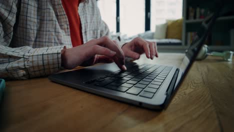 person typing on laptop