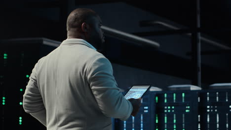 vertical video software developer in data center using tablet, employing machine learning